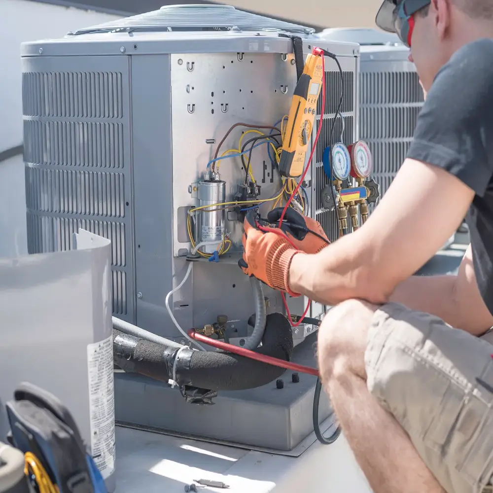Technician servicing an HVAC unit